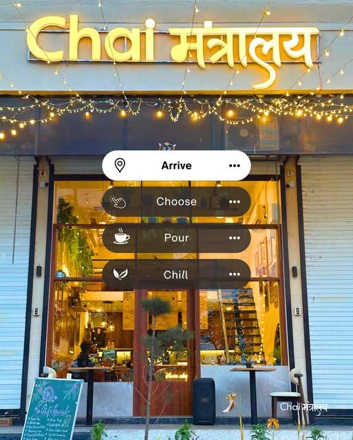 Chai Mantralaya storefront at night with the sign lit up