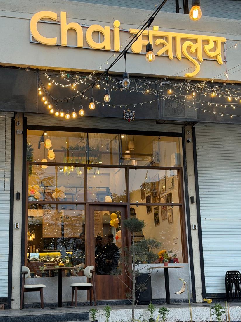 Chai Mantralaya storefront with its golden sign and fairy lights